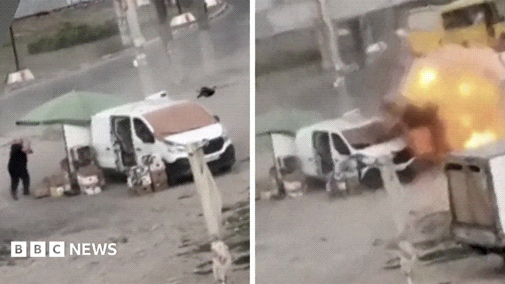 A man in black running past a white van and a green parasol as a drone bears down on him, and the same scene an instant later as the drone detonates.